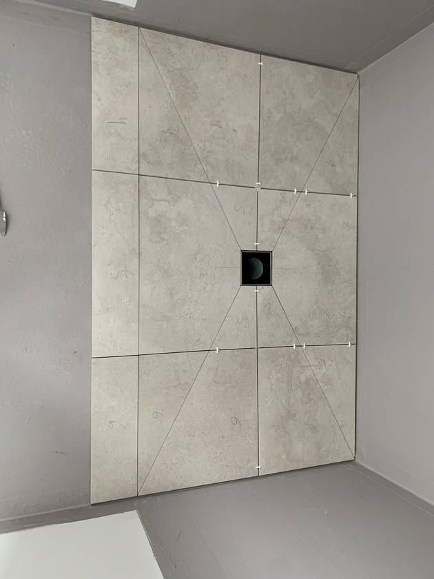 Cut to fall: Envelope cuts, so water runs evenly to a square centre waste.